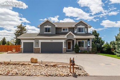 View of front of house with stucco siding, concrete driveway, a porch, stone siding, and an attached garage