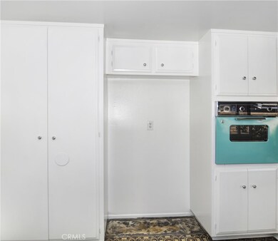 Refinished Kitchen with White Wooden Cabinetry