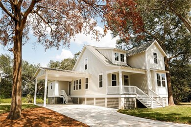 Coastal-style cottage with a spacious front porch,