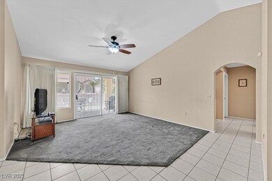 Living room with glass slider to backyard, light t