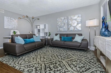 Living room featuring hardwood / wood-style floori