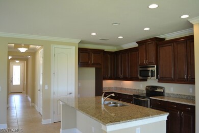 Natural light has been designed to travels from front to back in this gorgeous home.  The custom appointed kitchen with oversized low bar - the rave in today's open concept home designs.