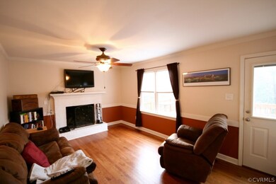 Cozy family room with fireplace and hardwood floor