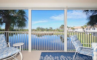 Sunroom / solarium featuring a water view