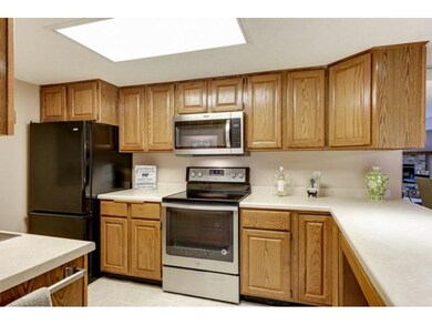 Kitchen features raised panel cabinetry, ceramic t