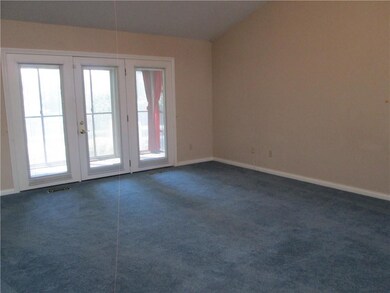 patio door to screened porch area that opens out to open patio
