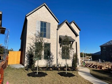 View of front of property with brick siding and f