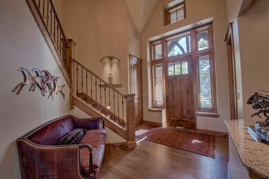 Step into the foyer of this stunning home with vau