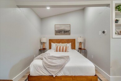 Bedroom featuring baseboards, light wood-style fl
