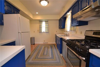 Large bright galley style kitchen with lots of cou