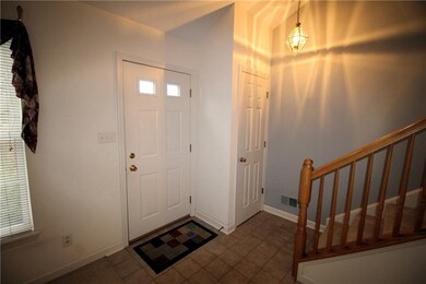 Ceramic tile entryway and guest closet.