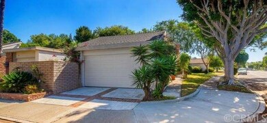 Corner lot with 2 car garage attached. Brick laced