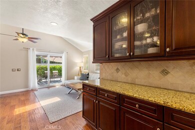 Butler pantry with glass frontcabinets located off teh kitchen/family rooms. More storage than you will need