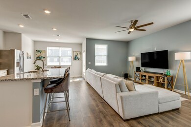 Open concept living room and kitchen for great entertaining! 