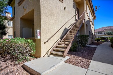 Property entrance featuring stucco siding