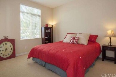 The large master bedroom with a private balcony an