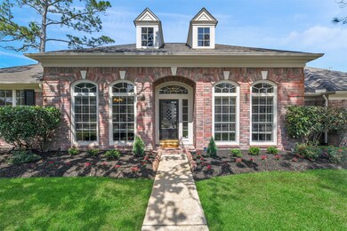 The front entry welcomes you with a beautiful leaded glass, solid wood front door. The black front door compliments the black shutters flanking the exterior far windows.
