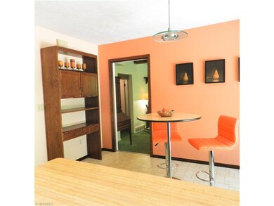 Kitchen eating area, looking into Family Room / Ad