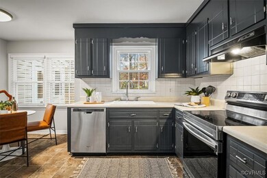 Kitchen with stainless steel appliances, tasteful