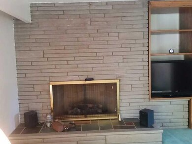 Other. Nice stone wall in living room with gas fir