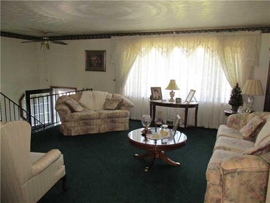 Living Room. The split-entry style adds to the ope