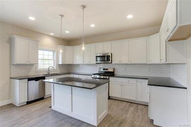 White Cabinets, Granite Tops, Stainless Steel Appl