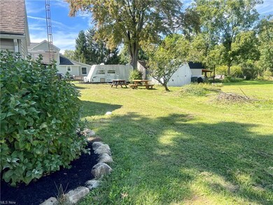 View of backyard featuring an outdoor structure