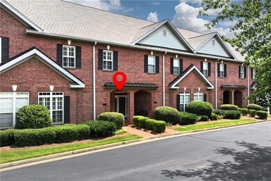 View of front of home featuring brick siding