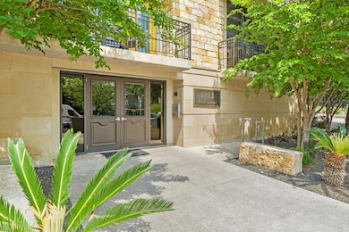 Property entrance with french doors, a balcony, a