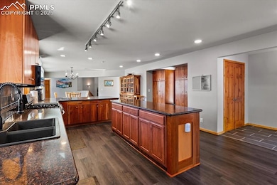 Kitchen featuring brown cabinets, recessed lightin