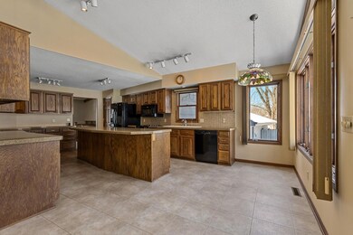 In this view you can see there is a great space for a table near the windows. There is also a dining space just around the corner for more formal meals or entertaining.