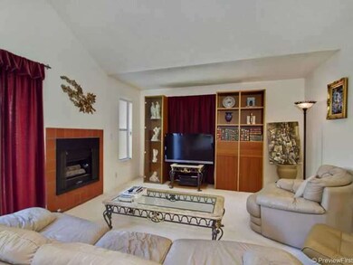 The living room offers lots of wall space and gas 