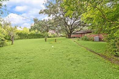 The lush and dense landscaping border around the p