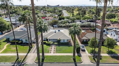 Located on palm-lined street