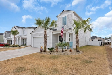 View of front of property with a garage and a fron