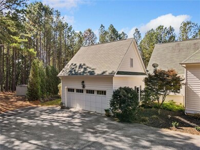 View of property exterior with driveway, a shingle