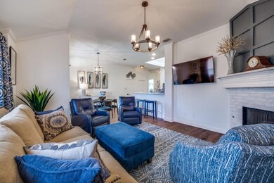 Living room featuring visible vents, baseboards, w