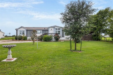 Single story home with a front yard