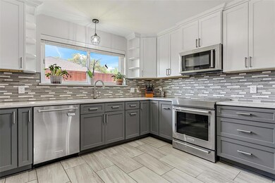 Spacious Kitchen with beautiful countertops and ba