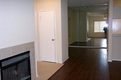 This view shows the dining room w/mirrored wall.