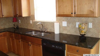 Granite Counter tops, Tile backslash, deep soaking sink and window to view outside make this kitchen inviting and comfortable for all gatherings.