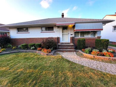 Single story home with a front yard