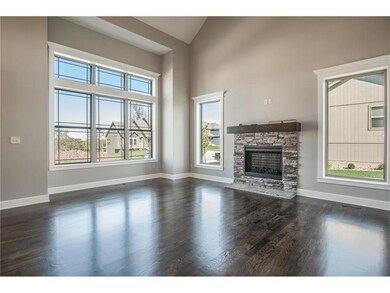 Dramatic vaulted ceiling in this room.  HARDWOOD F