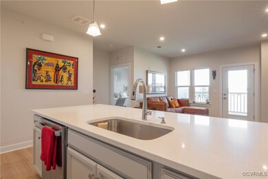 Kitchen with dishwasher, light wood-type flooring,