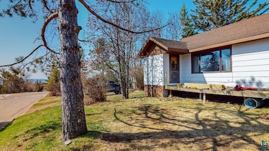 View of property exterior featuring roof with shin
