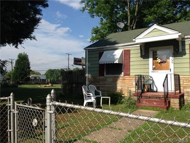 Exterior Front. Stone with Aluminum Siding. Roof w
