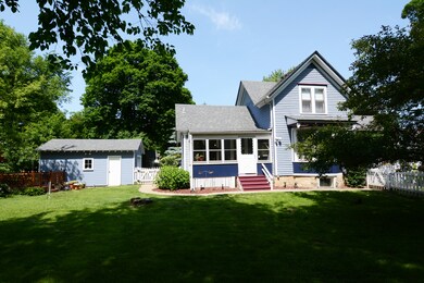 3 Season porch overlooking beautiful fenced yard.