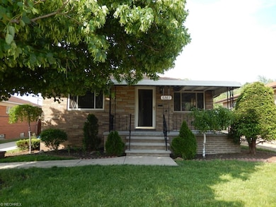 Front view with inviting front porch.