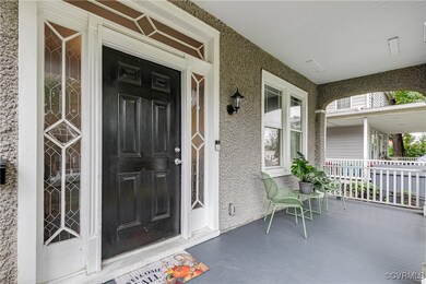 Doorway to property with covered porch