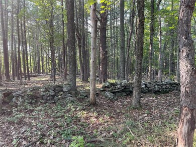 Stone wall to another buildinh site